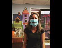 Woman wears two masks eats snack