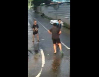 Boy dances by bus stuck in traffic 