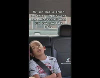 Little girl wakes up boy in backseat of car asleep