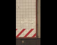 Handprints left on white tile wall subway 