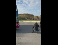 Guy poses in street for Eiffel Tower shot