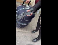 Woman pulls suitcase broke down while traveling 