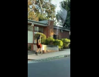 Man black shirt tiktok lively dance sidewalk