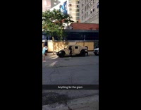 Girl black pants lean pose military vehicle
