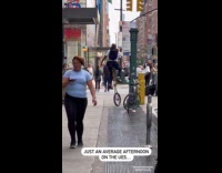 Collab WINY - Man riding unicycle on sidewalk 