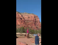 Woman pink outfit dance rock drone park