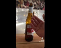 Guy caresses beer bottle before chugging it 