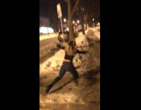 Girl jumps dances on ice sidewalk falls