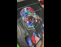 Woman paints stormtrooper on leather jacket 