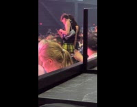 Collab IITW - Two person poses for video at concert