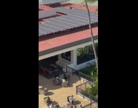 Man in jacket hoodie gets sturdy dance on the balcony