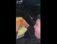 Guy barks before biting burger