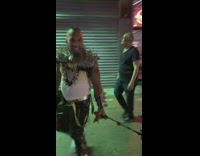 Guy plays empire state of mind on speaker with shoulder spikes 