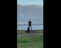 Blonde guy jumps and squats for video on bench 