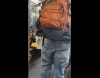 Orange backpack guy dances talks to himself 