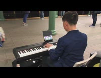 Collab Subway Creatures - man in blue suit plays piano in subway station