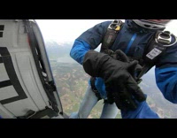Guy helmet jacket jump from helicopter skydive