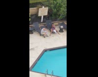 Woman in violet bikini poses at the sunbed