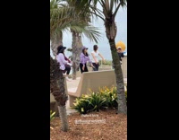 Collab IITW - Group of ladies works out near the beach 