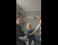 Parents flip over baby while holding hands