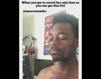 Guy holds phone water sprays on face 