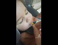 Baby spits out drink laughing 