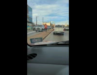 Man in red 42 jersey shirt tiktok dance in the middle of the street