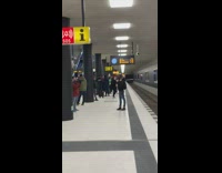 Black jacket girl poses subway station platform