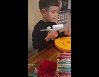 Little boy with glue gun waiting to die 