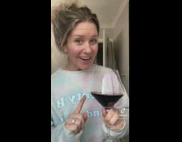 Woman fills her wine glass to the top 