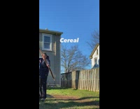 Guy shoots cereal ring with bow arrow 