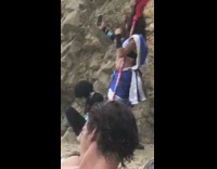 girl records weird people at beach