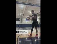 Guy spins and shoots basketball far from hoop 