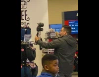 Guy vlogs at airport mile market