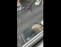 Woman walkman dances in parking lot 