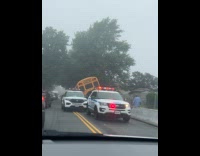 School bus drove up on concrete barrier