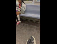 Girl eat crab leg inside the train