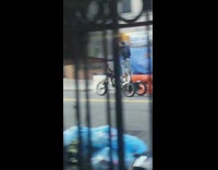 Guy drive motorcycle tricycle with tall handles down street loud engine