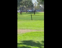 Guy helmet fail catch football park fence