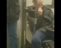 Guy with airpods picks nose and eats boogers on subway train