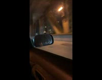 Guy rides electric unicycle next to car 