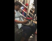 Spiderman plays bongos drums on subway train