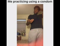 Practicing using a condom