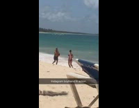 Instagram boyfriend in action running on beach