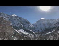 Guy watches large avalanche go down mountain 