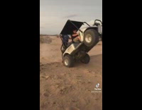 Guy does wheelie on golf cart 
