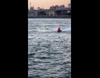 Person in Beetlejuice costume rides jet ski