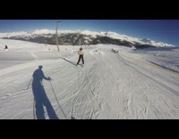 Collab JerrySlams - Guy in black overalls skis down slope and trips over safety net