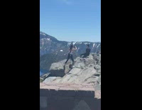 Black shirt guy girl mountain edge car