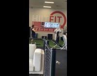 White hazmat suit elliptical machine indoor gym 